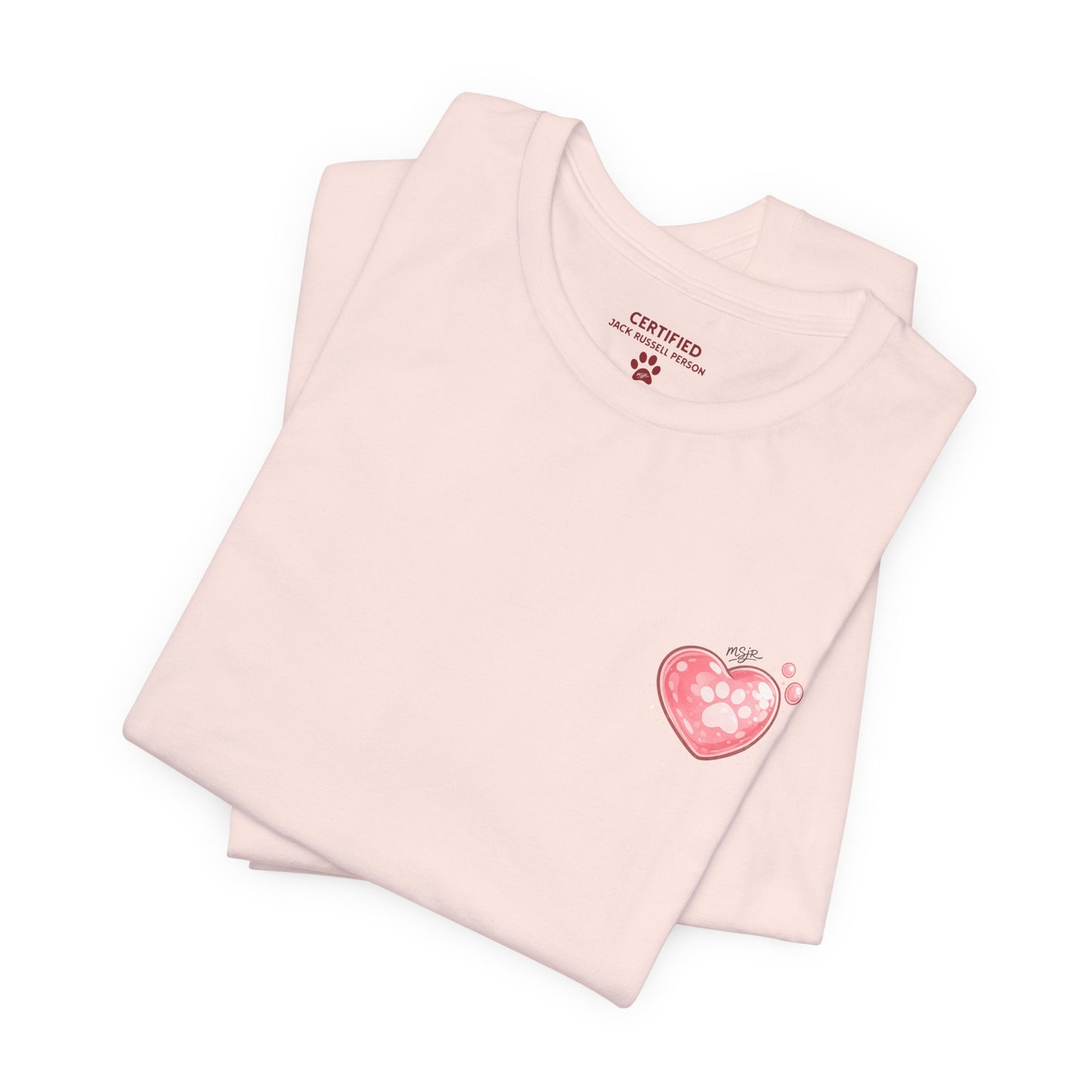 Folded soft pink Jack Russell Terrier t-shirt with small heart logo on front
