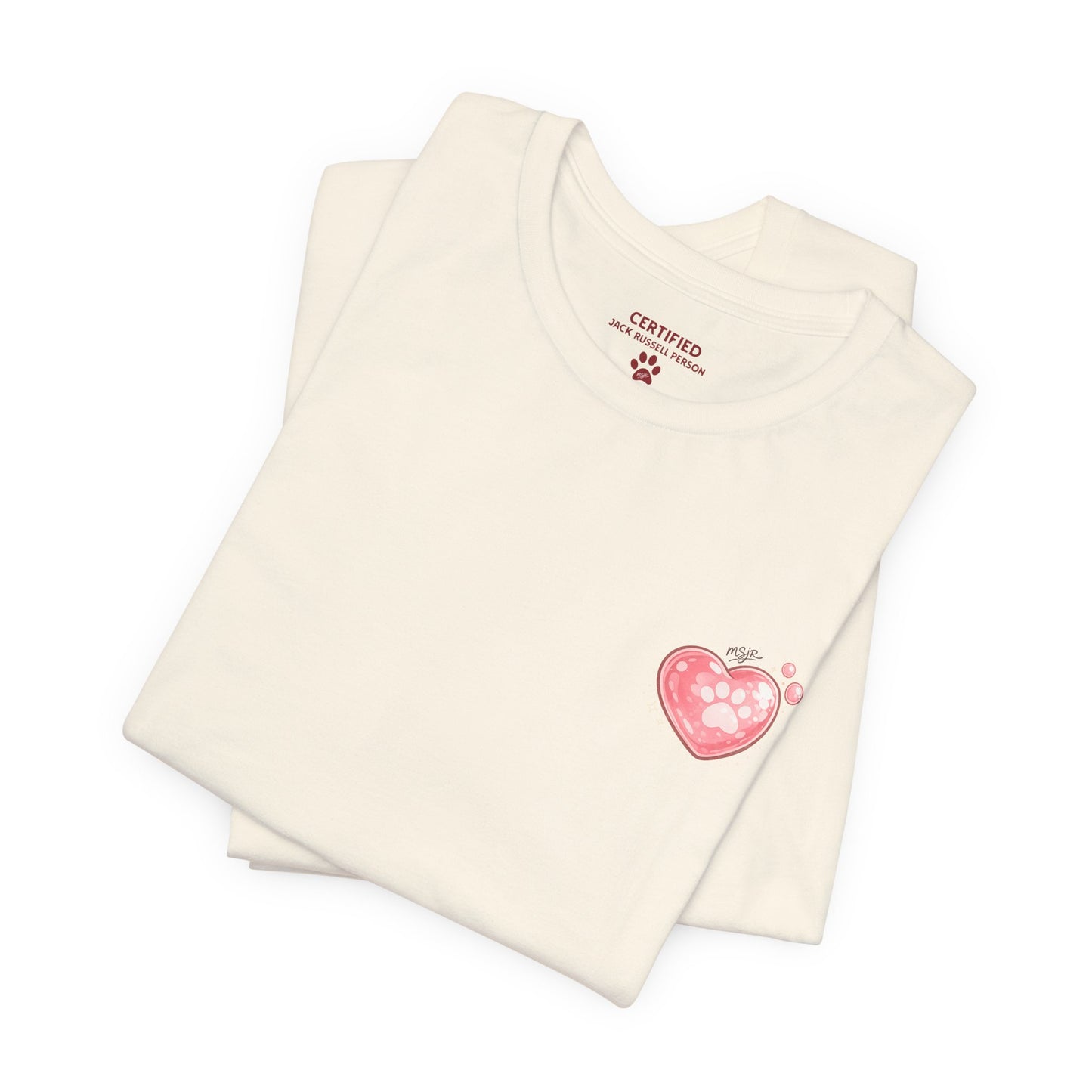 Folded natural color Jack Russell Terrier t-shirt with small heart logo on front